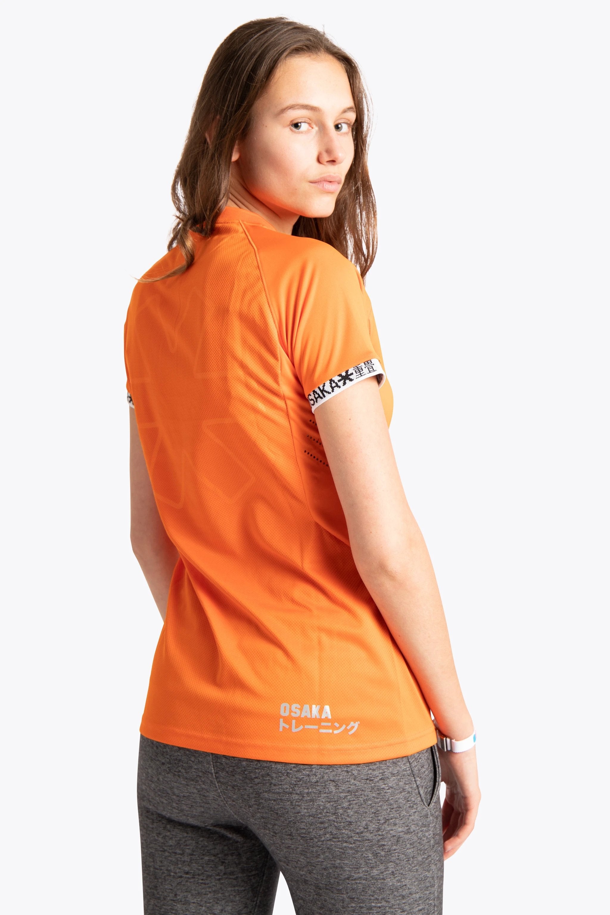osaka-women-jersey-arancione-maglia-hockey-prato-donna image 4